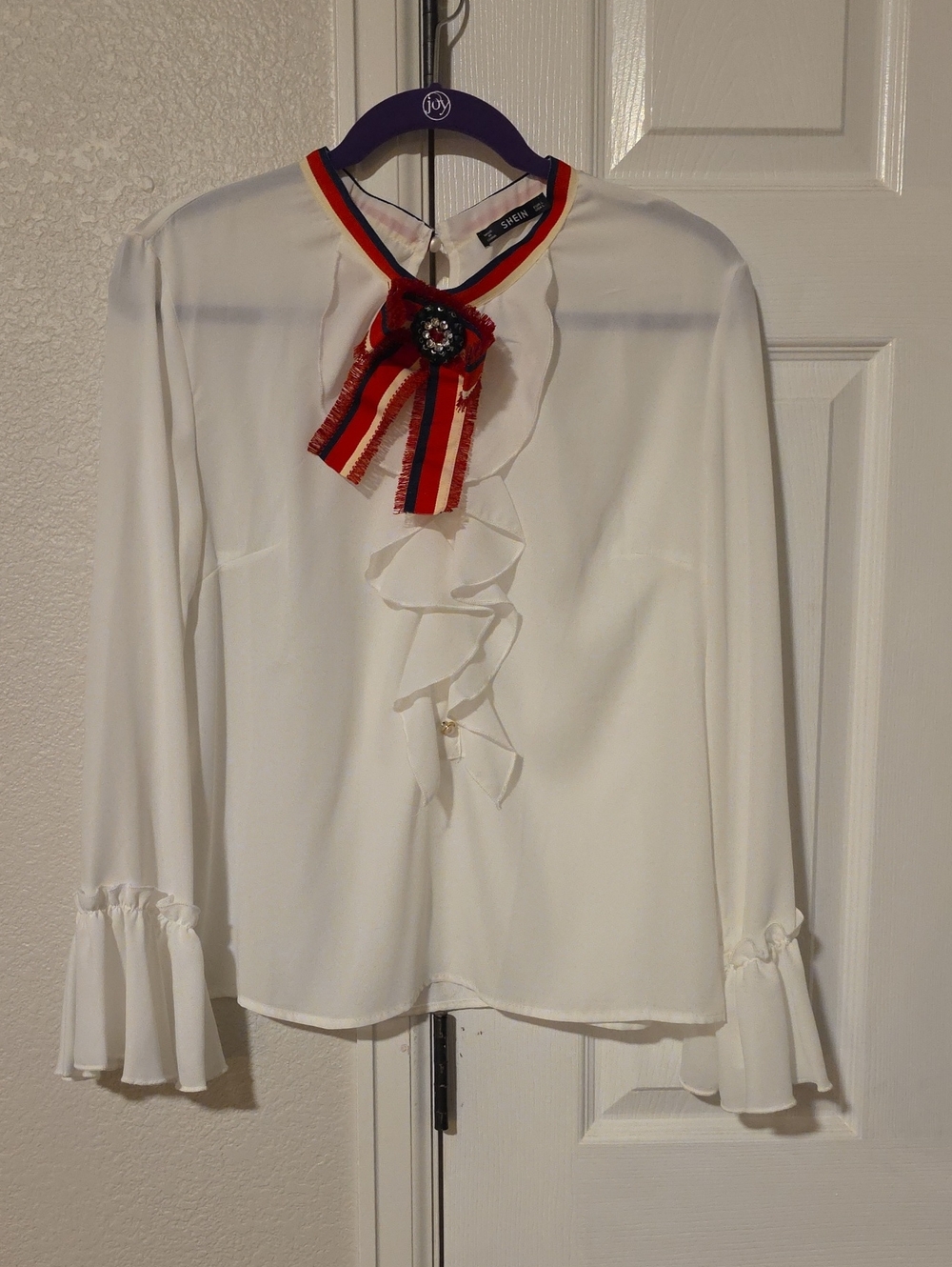 SHEIN White Ruffle Blouse with Red and Navy Ribbon Brooch